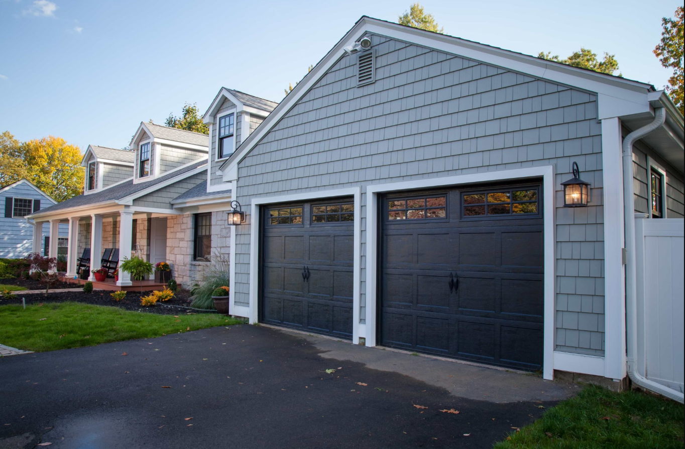 Technician repairing a garage door showcasing expertise in Local Garage Door Repair services