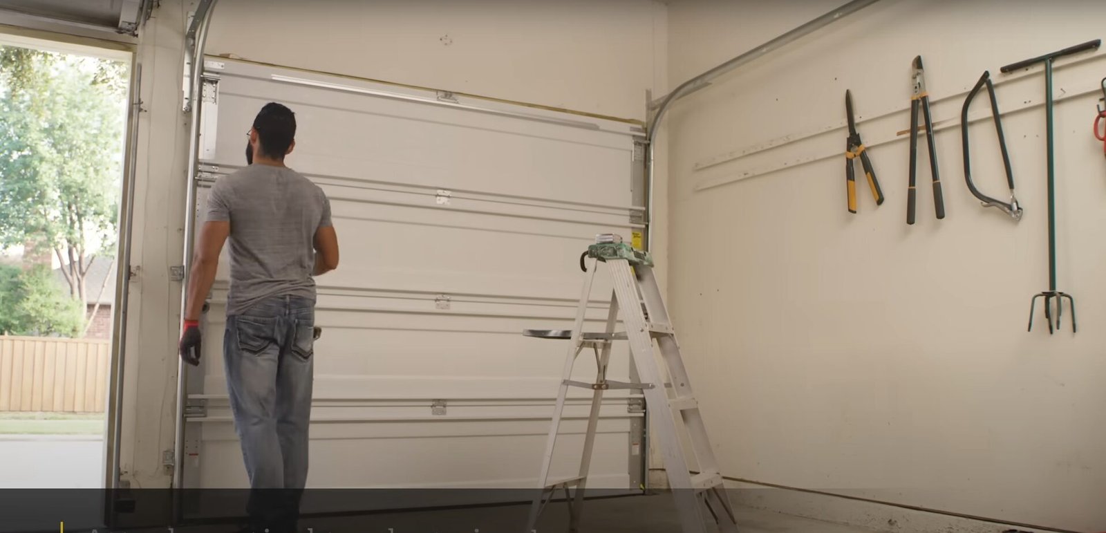 Illustration of a technician installing a garage door opener seamlessly during a garage door installation process