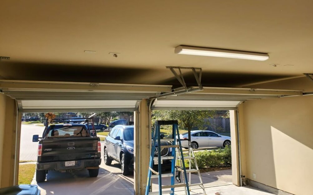 Technician performing professional garage door repair service in Foxleigh, ensuring smooth and efficient operation for residential garage doors.